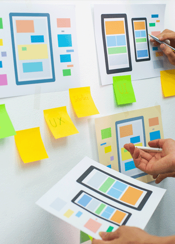 Website design process mapped out on whiteboard.