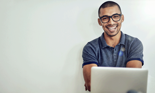 Smiling consultant working on laptop