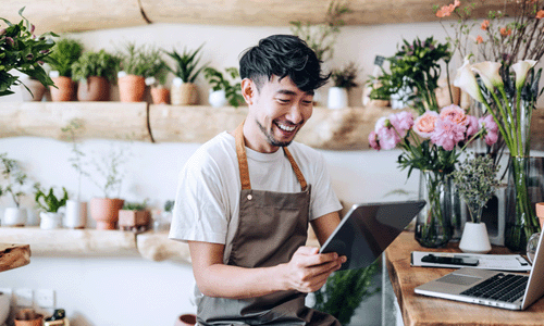 Small business owner updating their website from a tablet device.